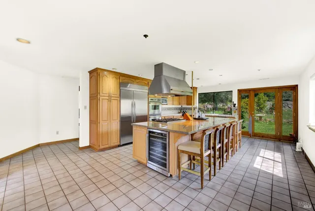 a spacious bedroom with a bed and ceiling fan