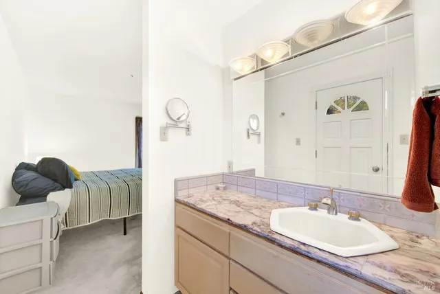 a view of a house with yard and sitting area