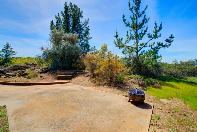 a view of a house with backyard porch and sitting area