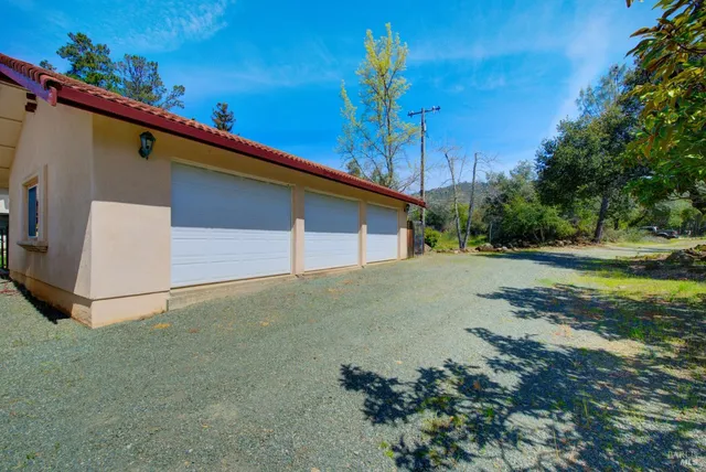 an aerial view of a house with a garden