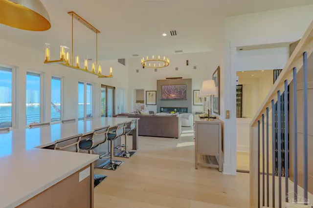a view of a livingroom with furniture and staircase