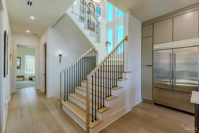 a view of entryway and hall with wooden floor