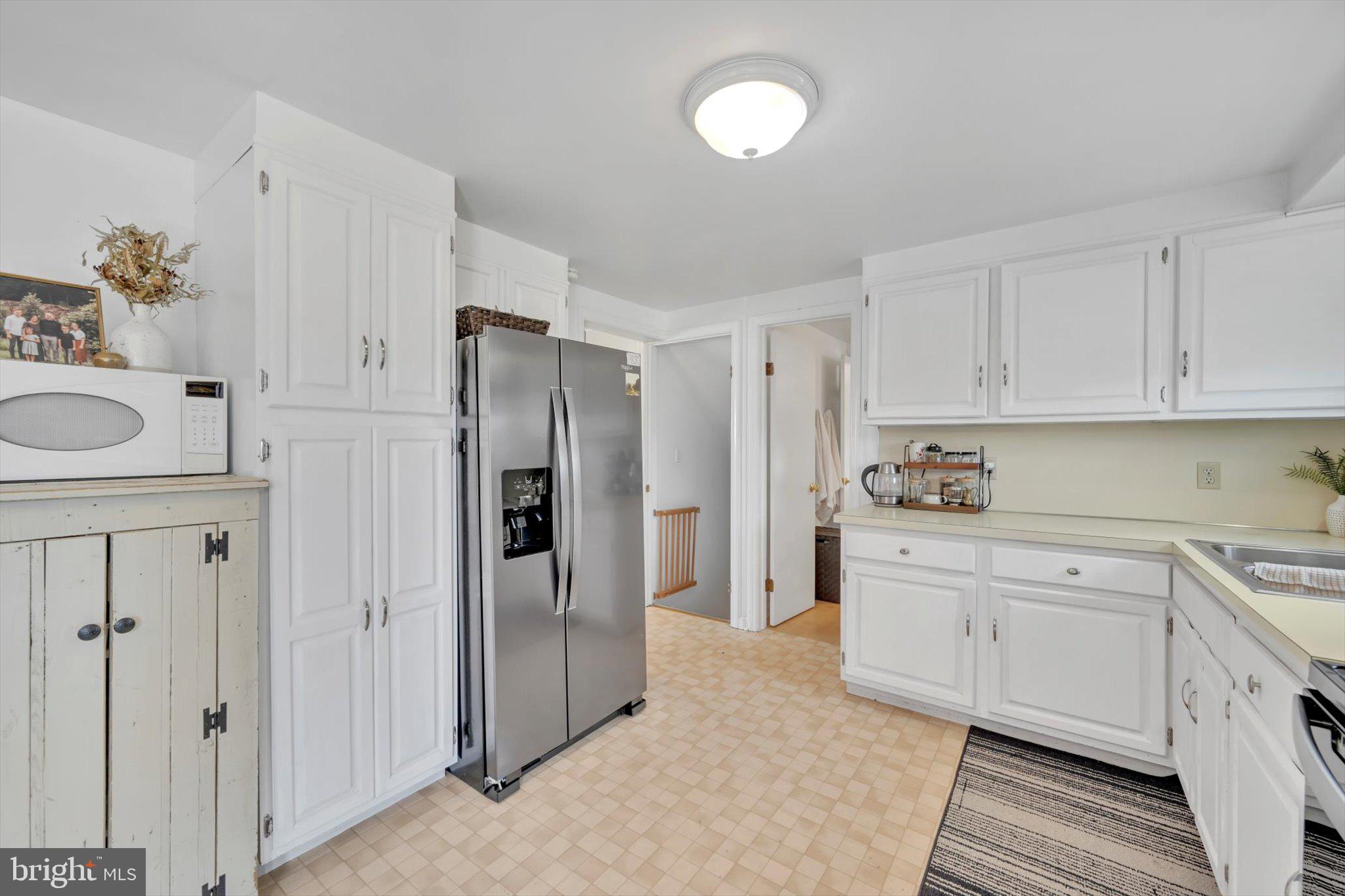 616 Georgetown Road Ronks, PA 17572 - Photo 11 of 35 a kitchen with stainless steel appliances granite countertop a refrigerator and a stove