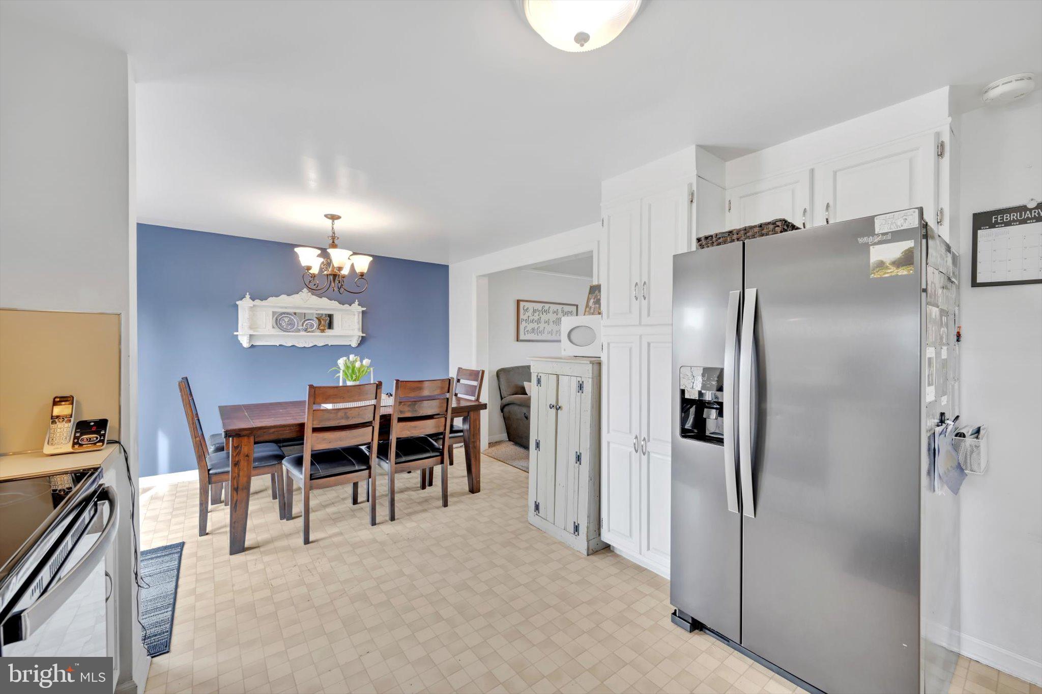 616 Georgetown Road Ronks, PA 17572 - Photo 14 of 35 a kitchen with stainless steel appliances a refrigerator a table and chairs