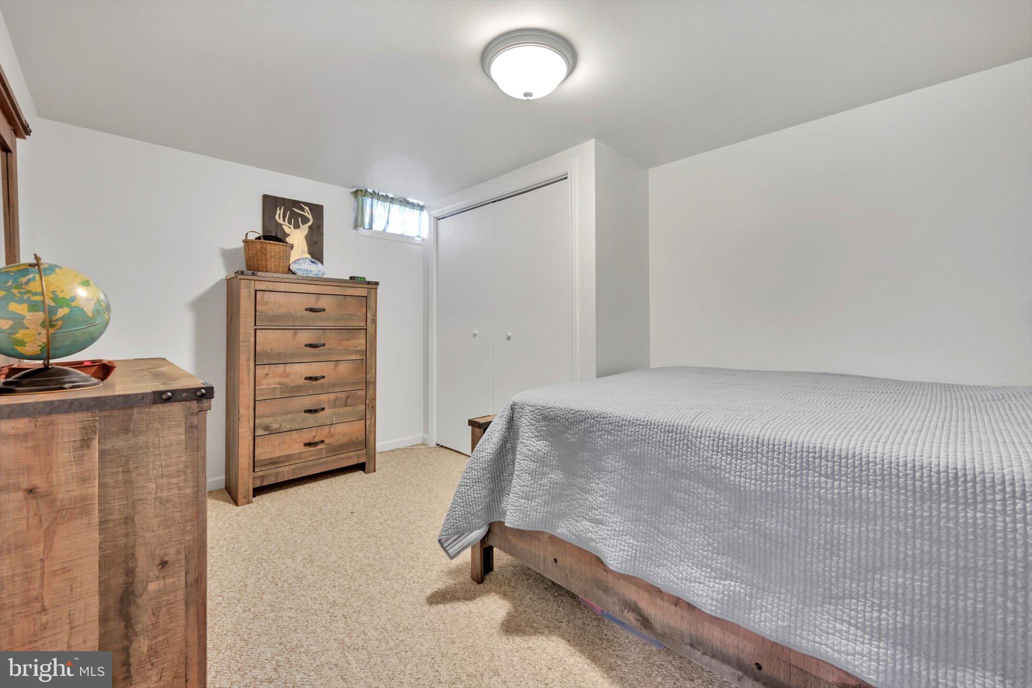 616 Georgetown Road Ronks, PA 17572 - Photo 27 of 35 a bedroom with a bed and a desk