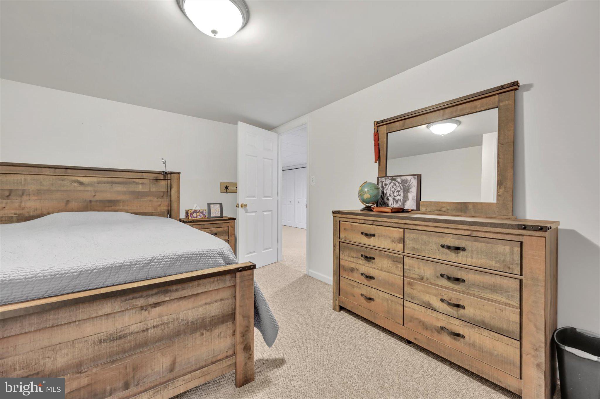 616 Georgetown Road Ronks, PA 17572 - Photo 28 of 35 a bedroom with a bed and a dresser