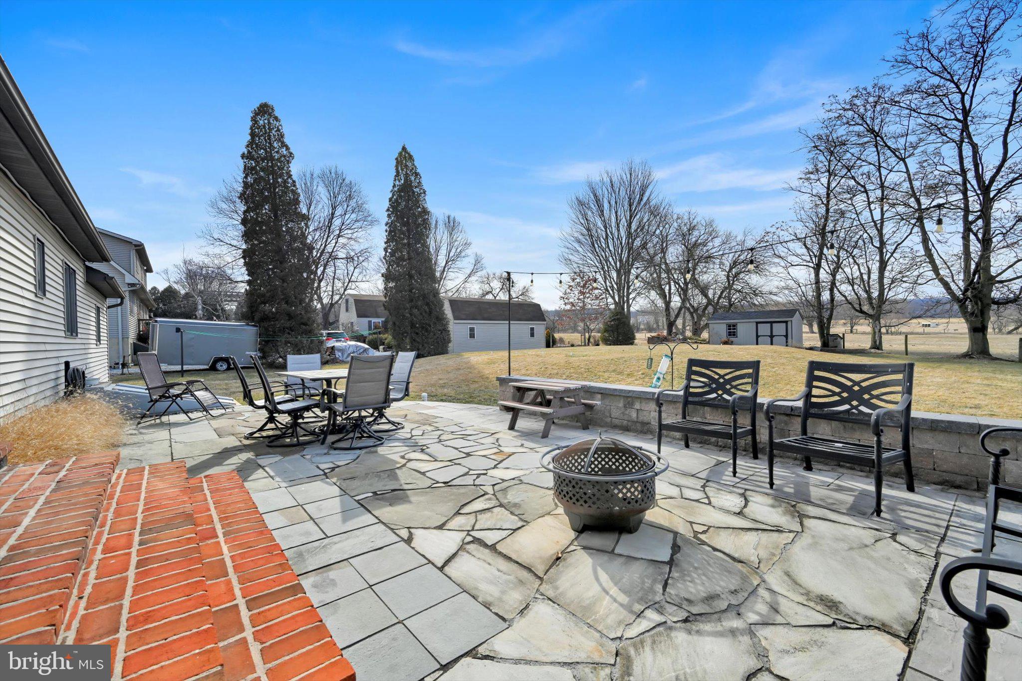 616 Georgetown Road Ronks, PA 17572 - Photo 31 of 35 a view of a patio with a dining table and chairs with wooden floor and fence