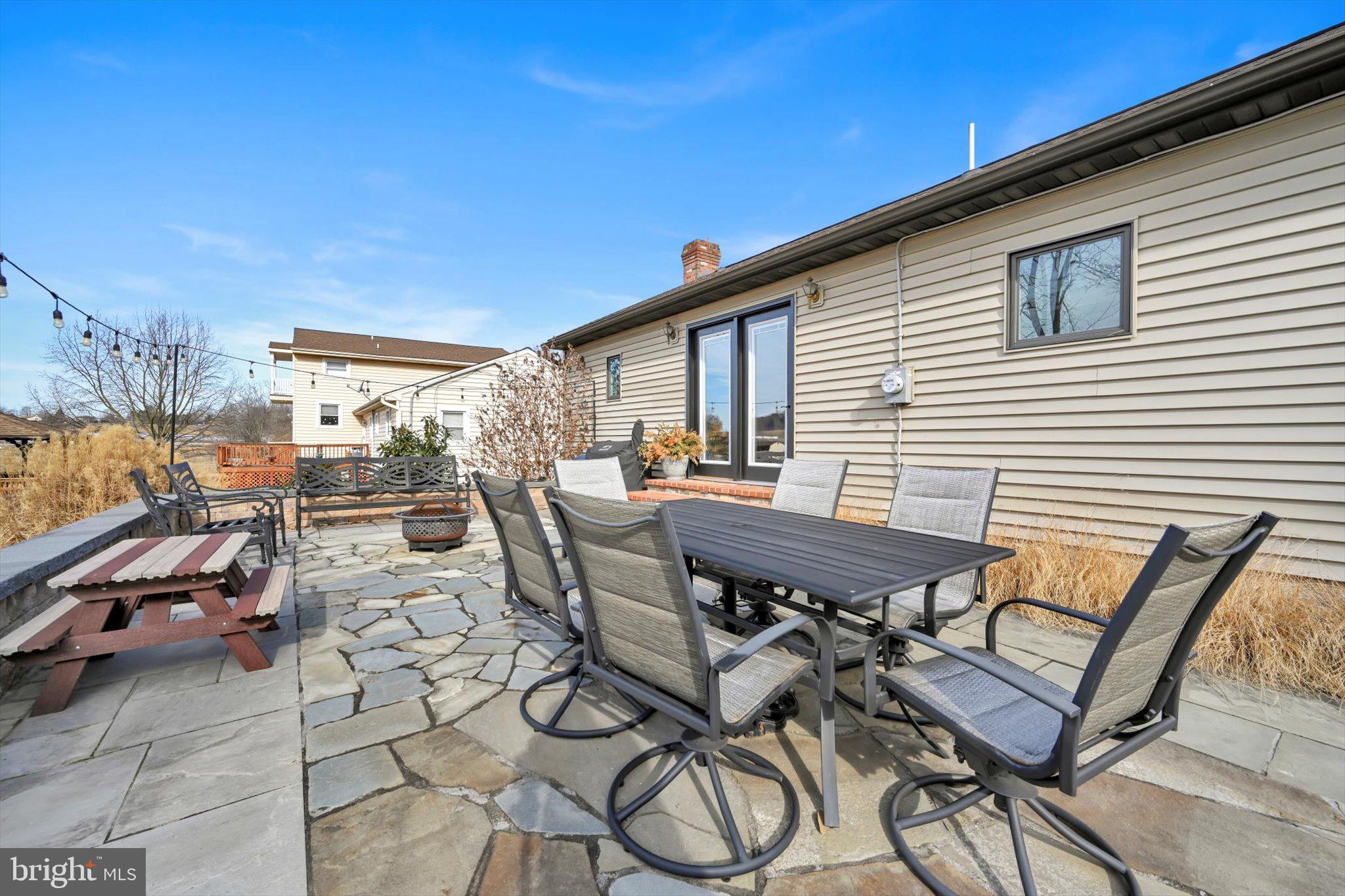 616 Georgetown Road Ronks, PA 17572 - Photo 32 of 35 a view of a patio with table and chairs and potted plants