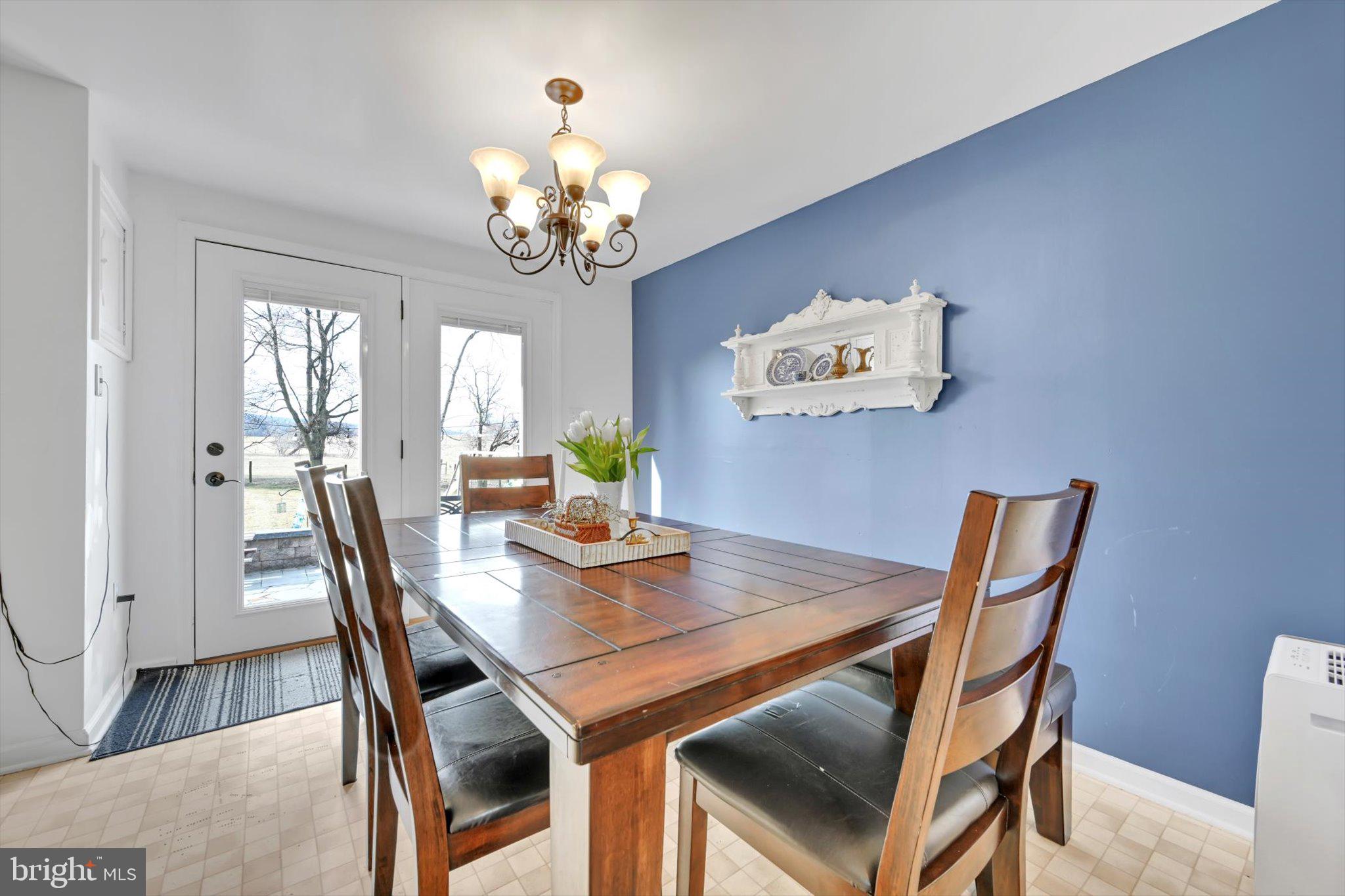 616 Georgetown Road Ronks, PA 17572 - Photo 9 of 35 a view of a dining room with furniture and chandelier