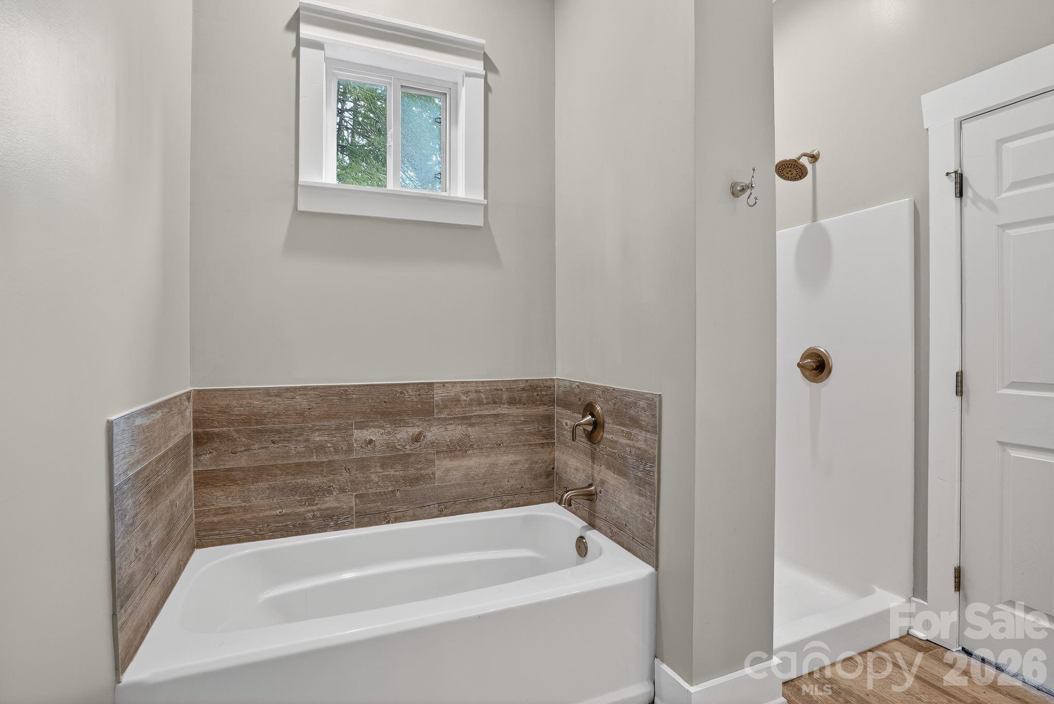 155 North Fork Road Black Mountain, NC 28711 - Photo 11 of 26 a bathroom with a tub