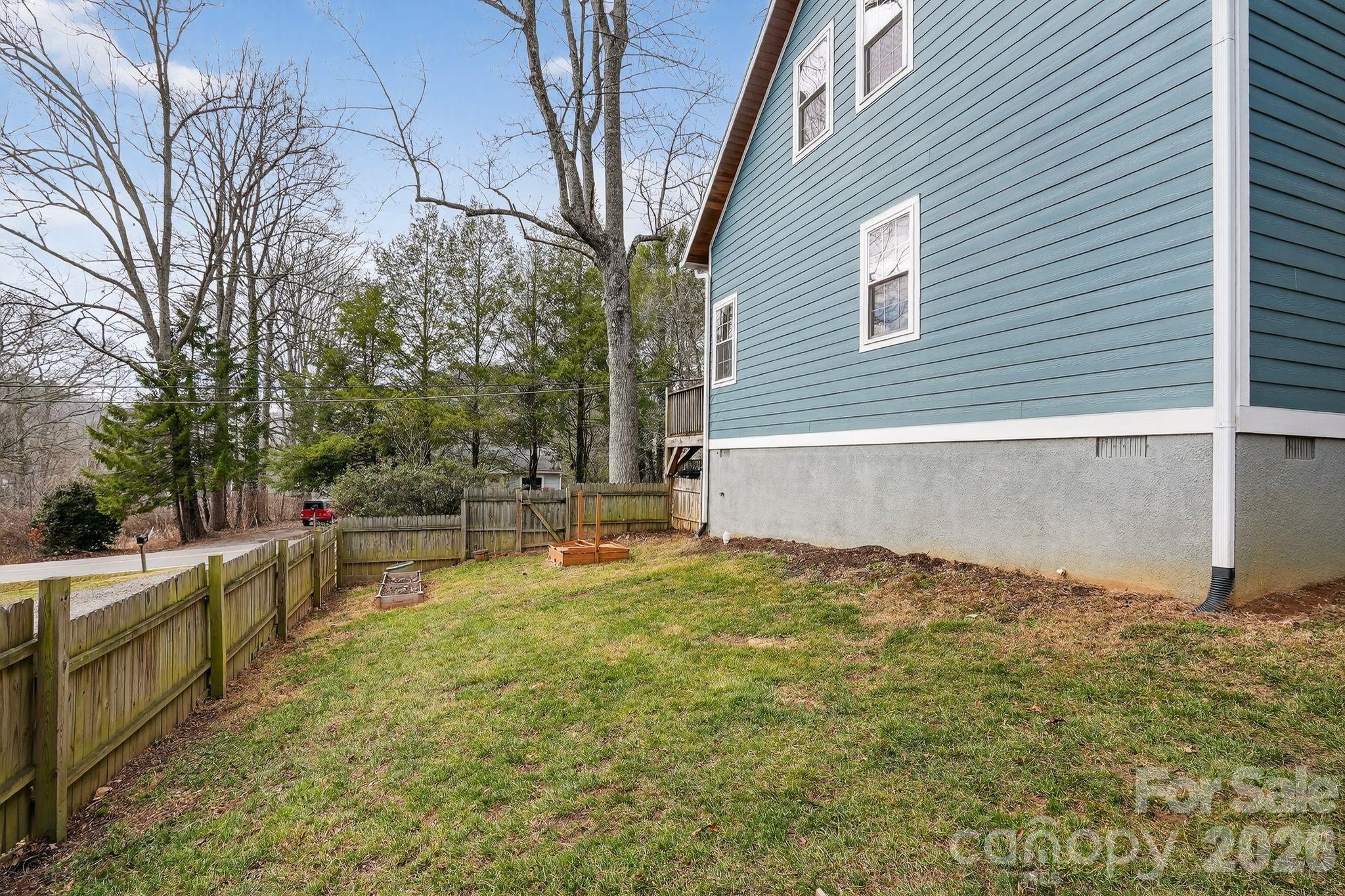 155 North Fork Road Black Mountain, NC 28711 - Photo 21 of 26 a view of a backyard with a large tree