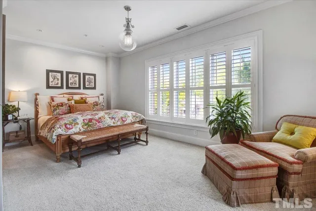 a bedroom with bed and a window