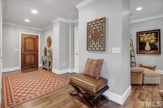 a bedroom with furniture and a rug