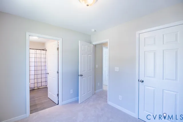 an empty room with closet area