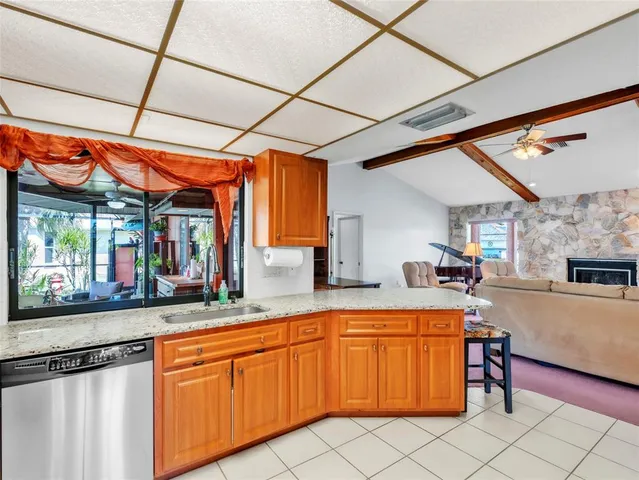 a kitchen with stainless steel appliances granite countertop a sink and cabinets