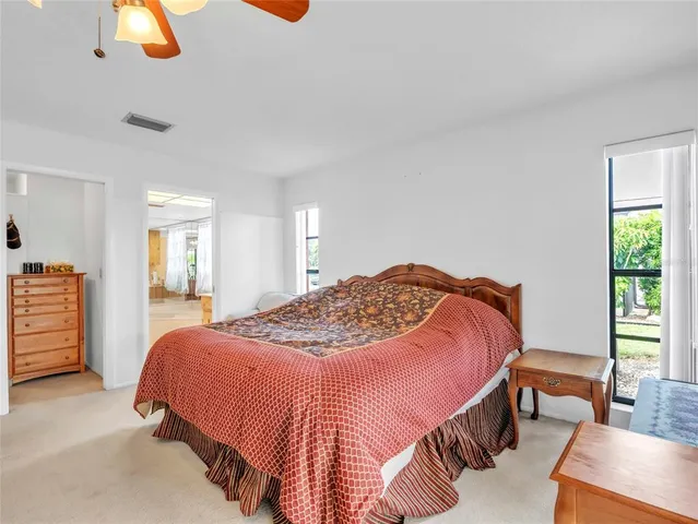 a bedroom with a bed and dresser