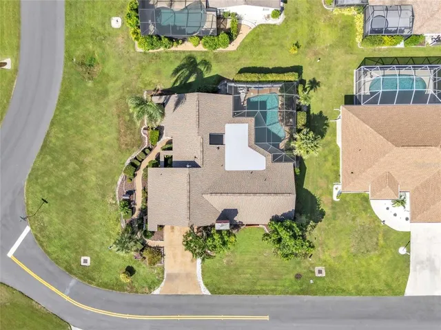 an aerial view of a residential apartment building with a yard