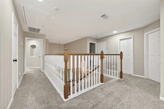 a view of a hallway with a livingroom