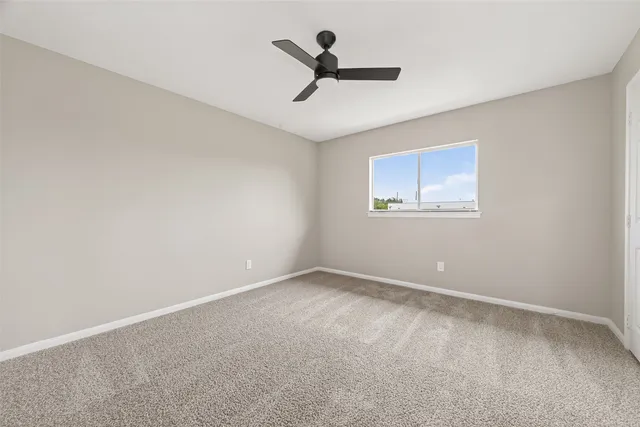 a view of room with ceiling fan