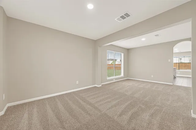 a view of an empty room with a window