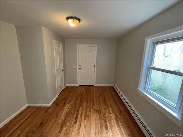 a view of wooden floor in an empty room