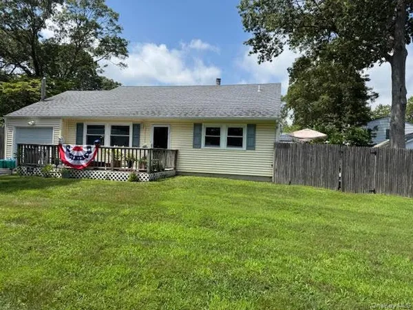 a front view of house with yard and seating space