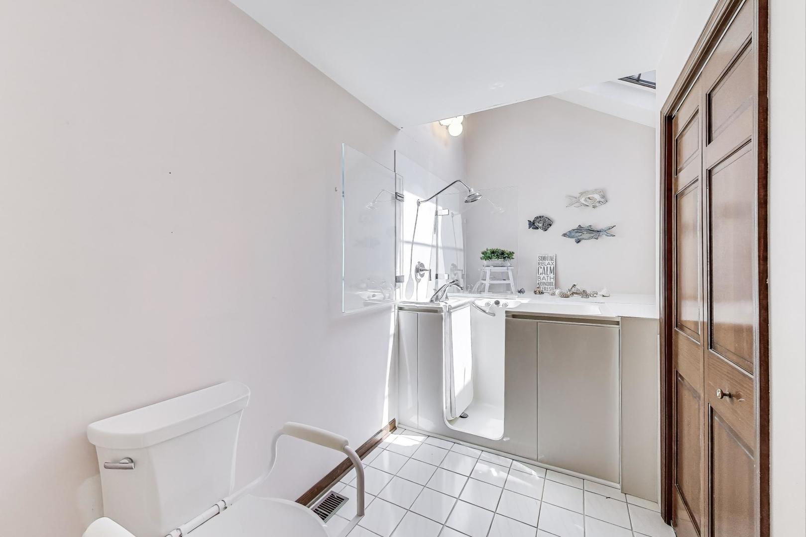 2080 Carolyn Road Aurora, IL 60506 - Photo 28 of 50 a bathroom with a sink a toilet and shower