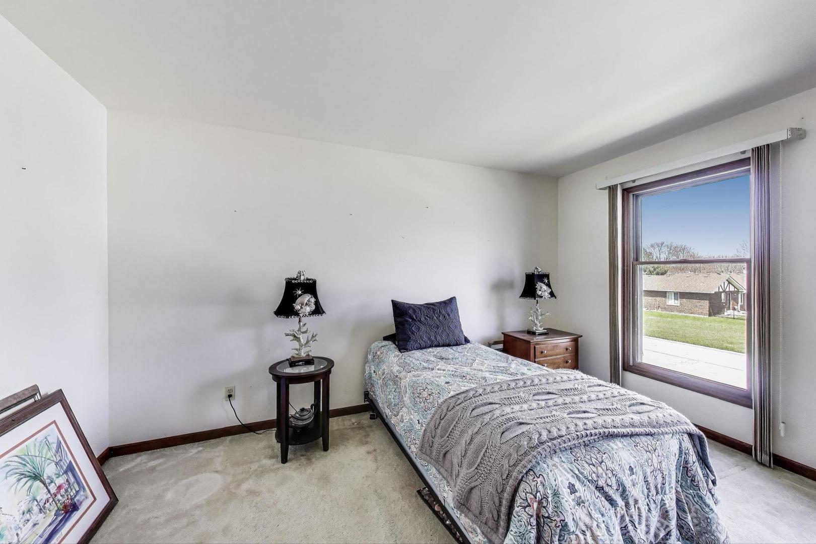 2080 Carolyn Road Aurora, IL 60506 - Photo 29 of 50 a bedroom with a bed and a window