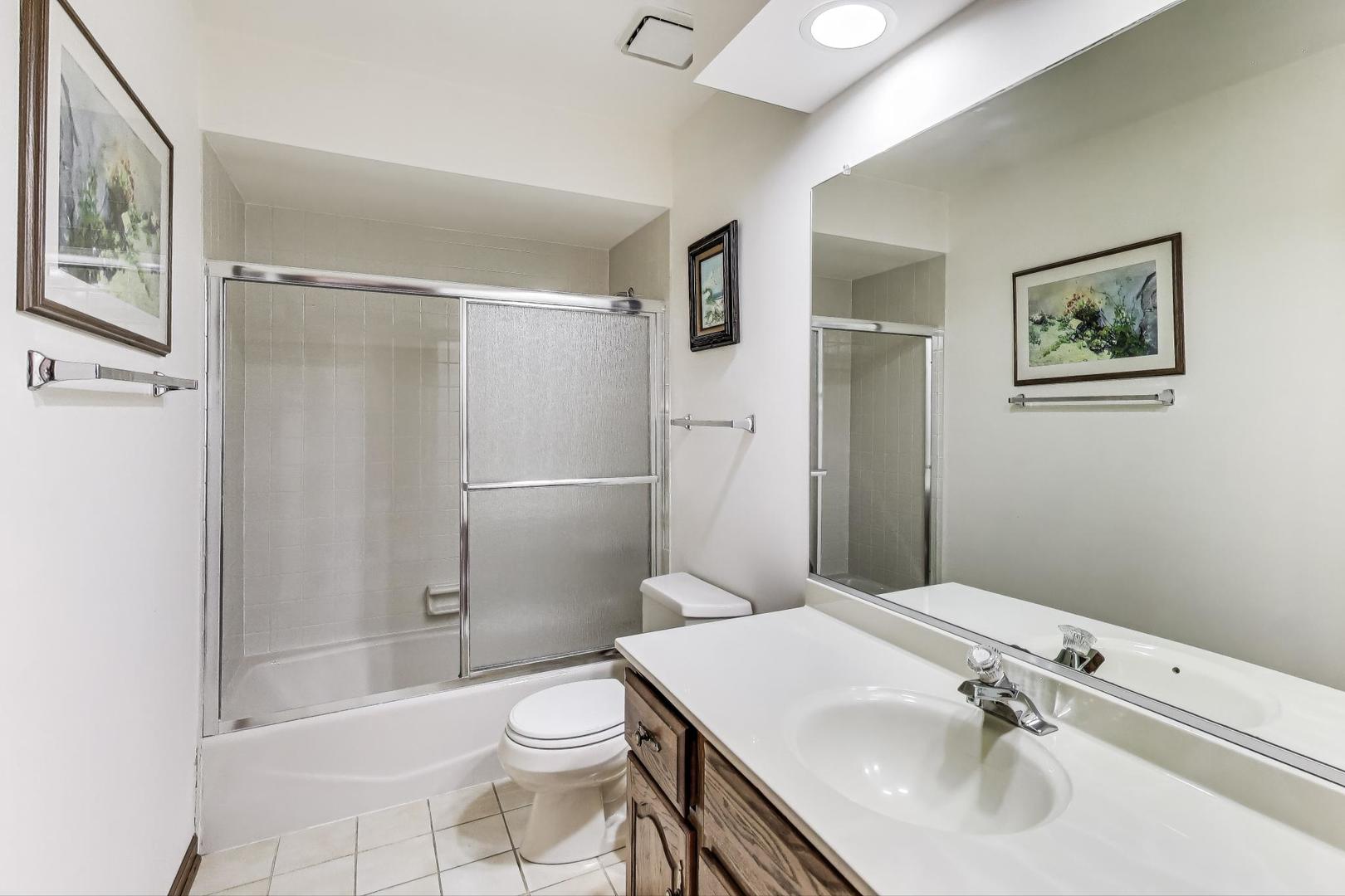 2080 Carolyn Road Aurora, IL 60506 - Photo 35 of 50 a bathroom with a sink toilet and shower