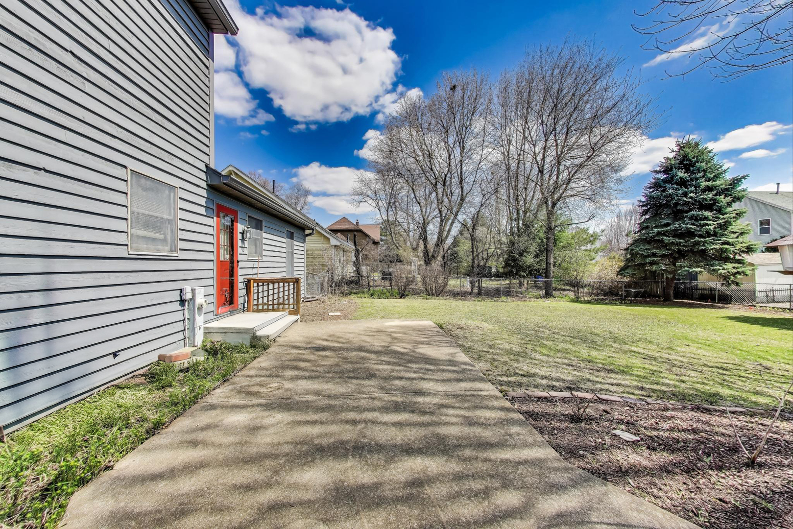 2080 Carolyn Road Aurora, IL 60506 - Photo 43 of 50 a view of a backyard with plants and large trees