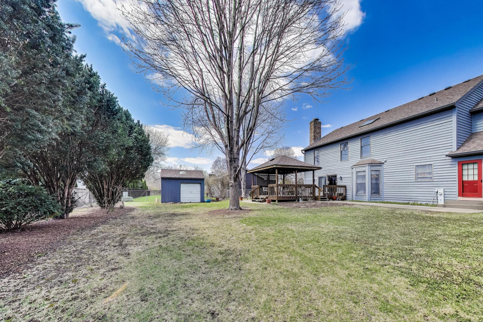 2080 Carolyn Road Aurora, IL 60506 - Photo 44 of 50 a view of a house with a big yard and large trees