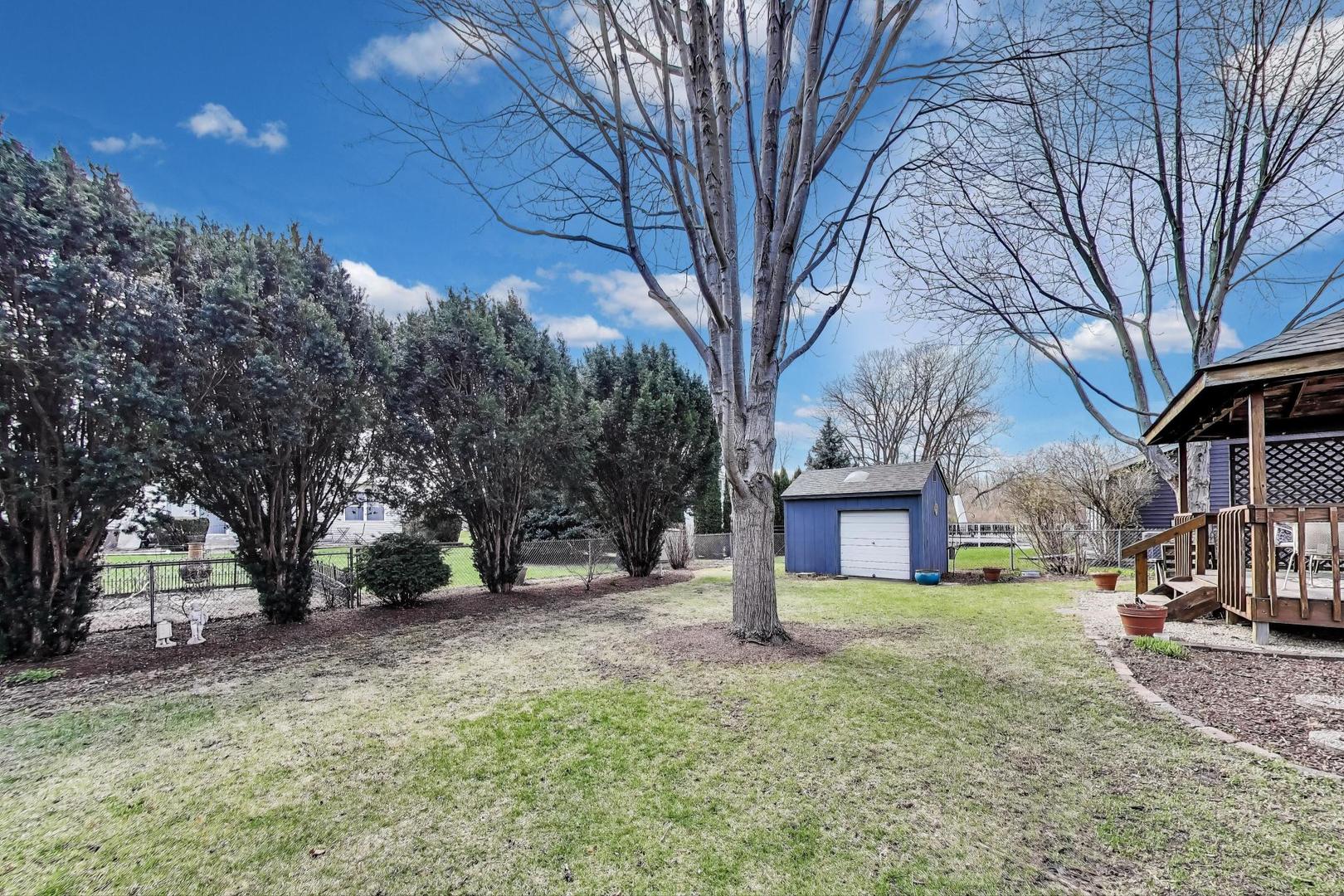 2080 Carolyn Road Aurora, IL 60506 - Photo 46 of 50 a view of a yard with a house and tree