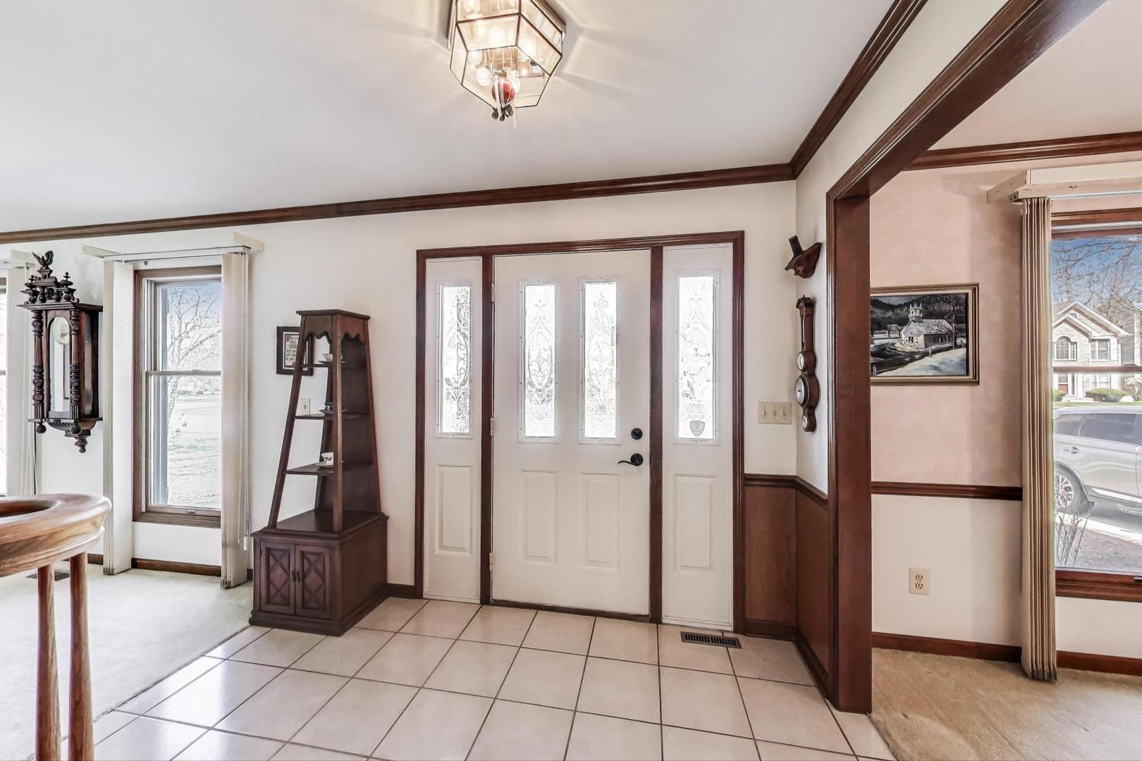 2080 Carolyn Road Aurora, IL 60506 - Photo 5 of 50 a view of an entryway with a chandelier