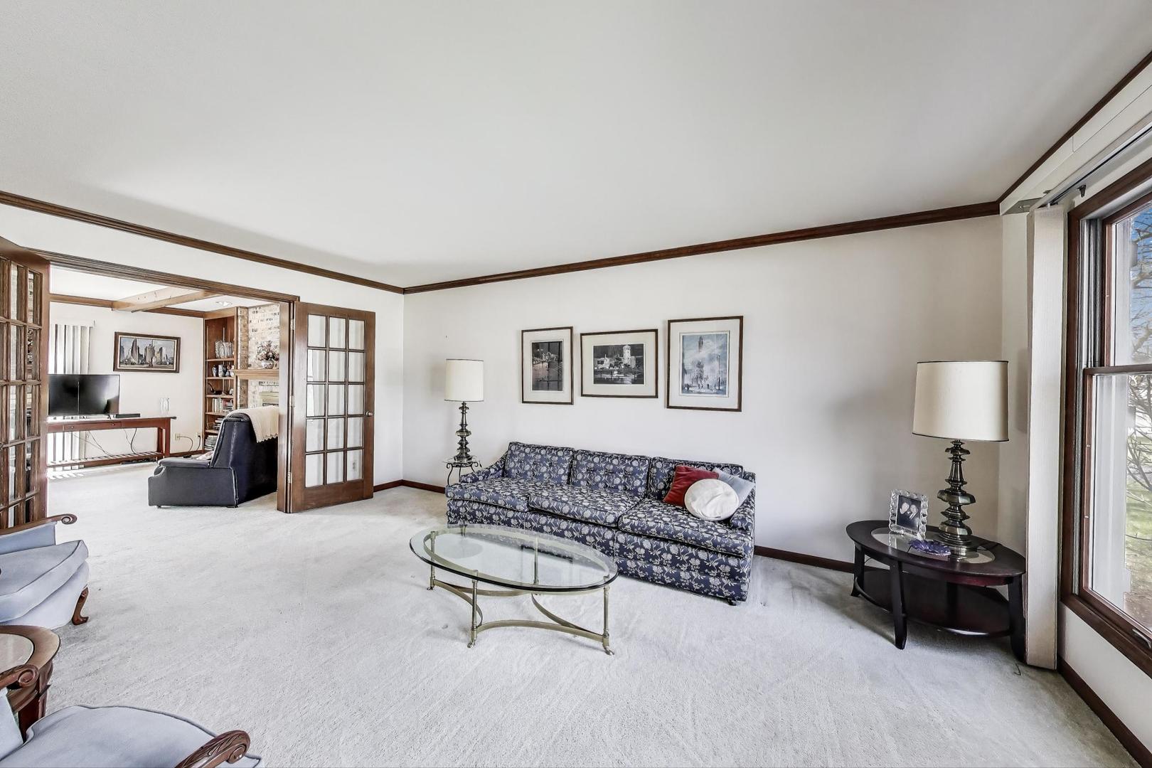 2080 Carolyn Road Aurora, IL 60506 - Photo 6 of 50 a living room with furniture and a lamp