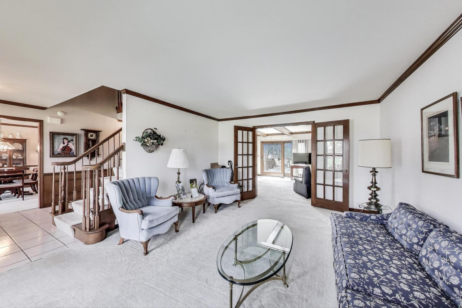 2080 Carolyn Road Aurora, IL 60506 - Photo 7 of 50 a living room with furniture and a wooden floor