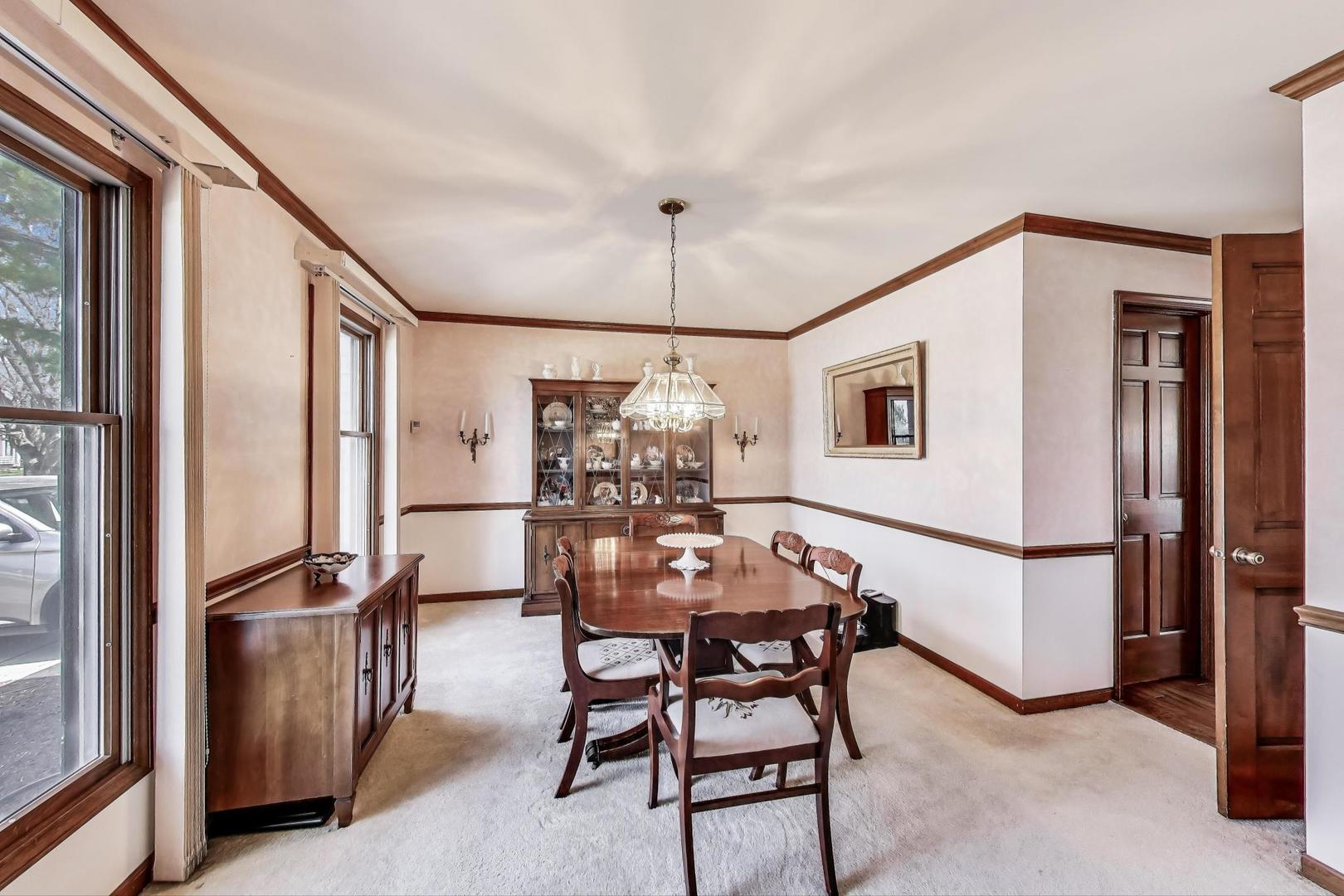 2080 Carolyn Road Aurora, IL 60506 - Photo 9 of 50 a view of a dining room with furniture window and wooden floor