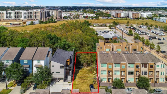 an aerial view of residential building with swimming pool and outdoor space