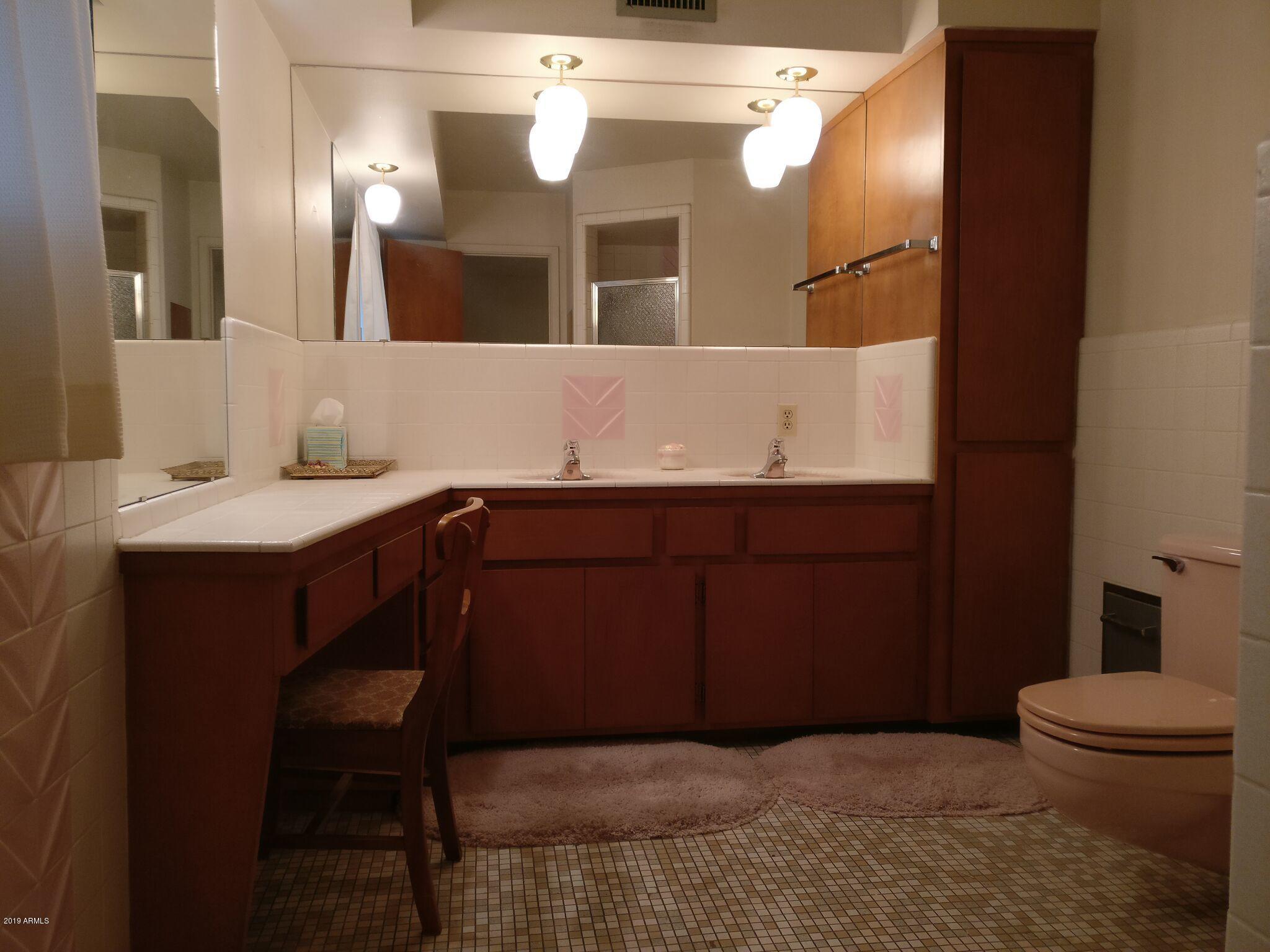 3733 West Ocotillo Road Phoenix, AZ 85019 - Photo 10 of 24 a bathroom with a sink and a toilet