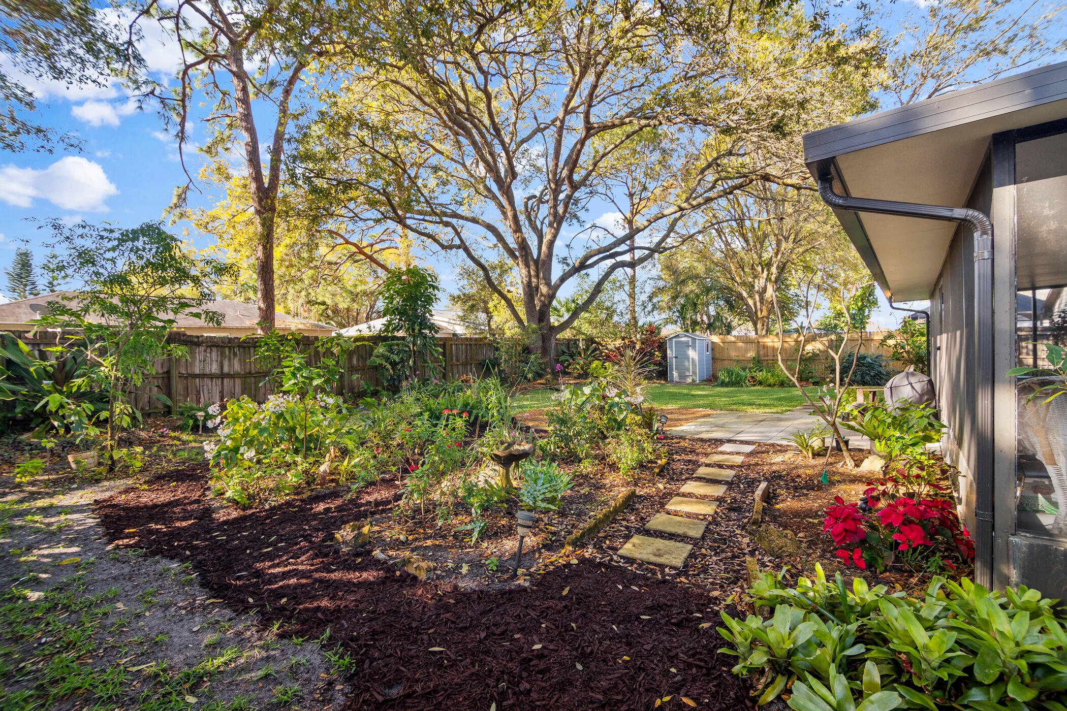 849 Gardener Road Rockledge, FL 32955 - Photo 25 of 31 a backyard of a house with lots of green space