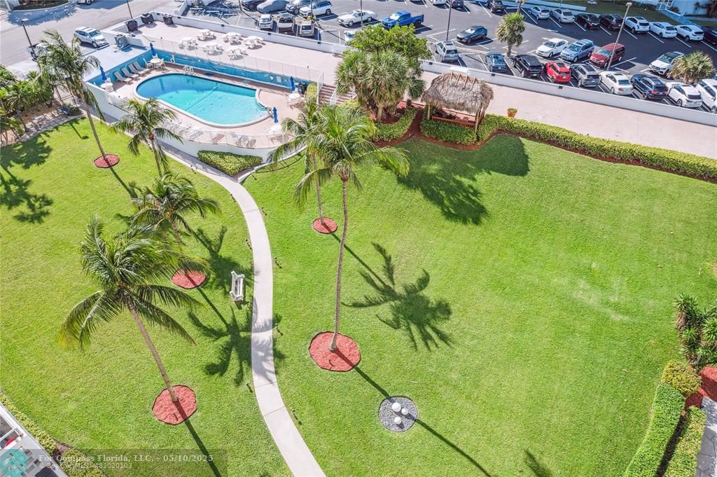 1900 South Ocean Drive, Unit 905 Fort Lauderdale, FL 33316 - Photo 26 of 41 Balcony views of Breakwater Towers pristine grounds and pathway to your private heated pool.