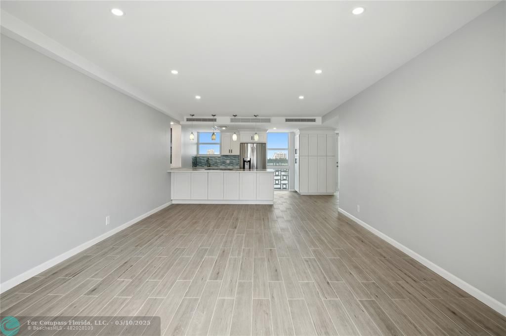 1900 South Ocean Drive, Unit 905 Fort Lauderdale, FL 33316 - Photo 8 of 41 Spacious living room with AC system fully concealed in the ceiling, enjoy Lake Mayan, Port Everglades and ocean views. All new wiring, dimmable light switches, 17 LED recessed lights throughout, a new balcony light, and USB charging ports integrated into the island outlets.