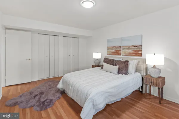 a bedroom with a bed and a table