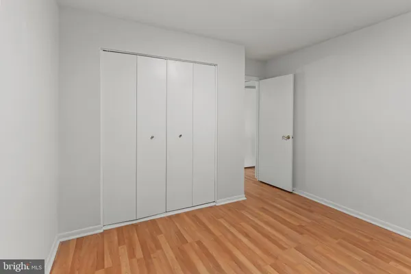 a view of room with wooden floor