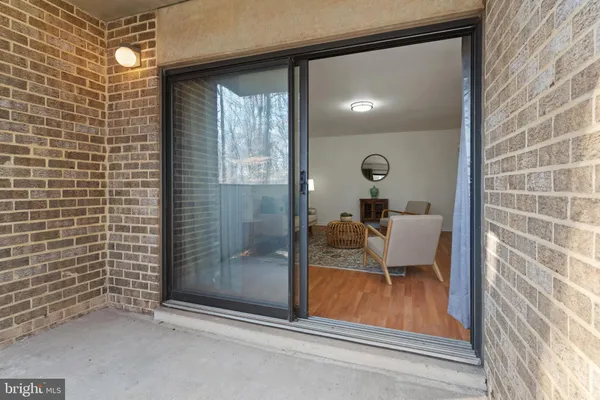 a view of a hallway with livingroom and dining room view