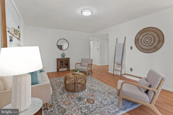 a living room with furniture and a mirror