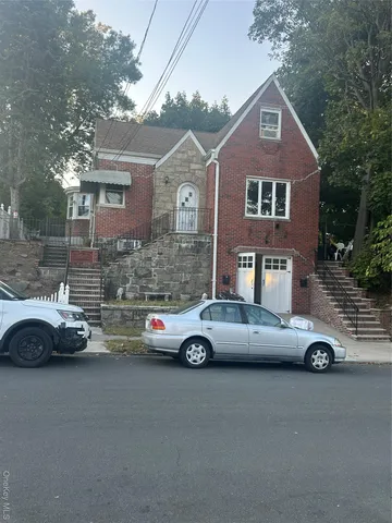 a car parked in front of a house