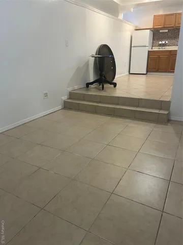 a view of storage and utility room with racks on the wall