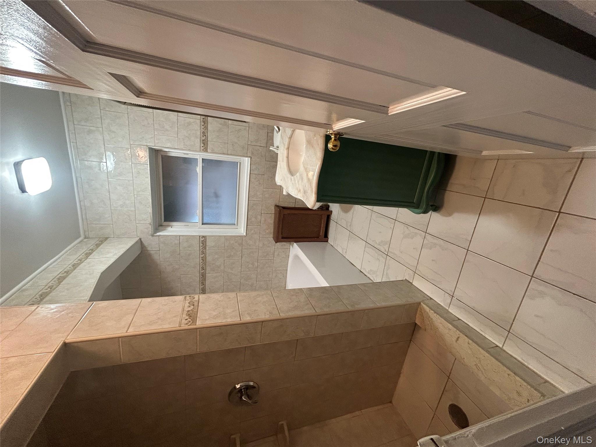 141 Sterling Avenue Yonkers, NY 10704 - Photo 17 of 23 a bathroom with a toilet and a sink