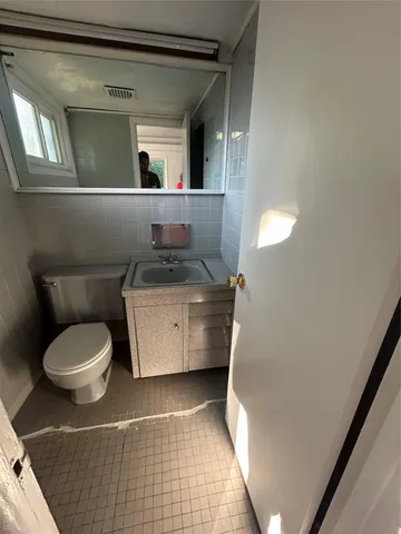 a view of gallery with wooden floor