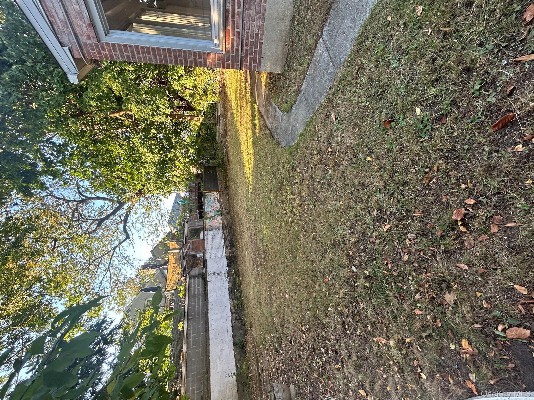 141 Sterling Avenue Yonkers, NY 10704 - Photo 2 of 23 a view of yard with large tree